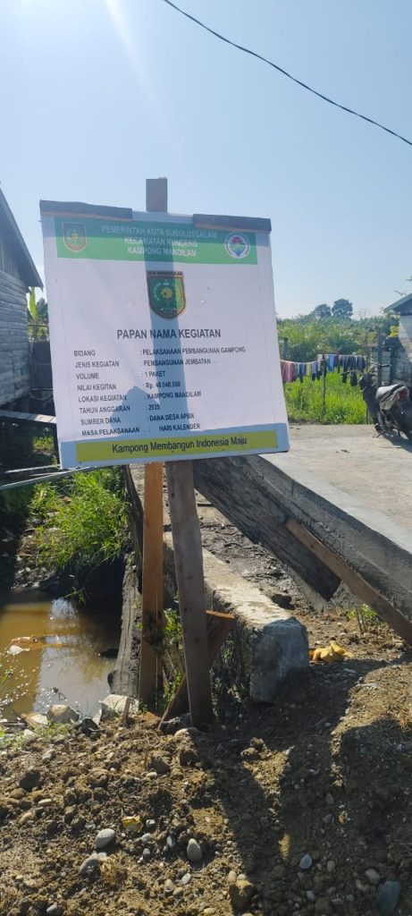 Diduga Mark-Up 50 %, Konsultan Pembangunan Jembatan Di Kampong Mendilam, Layaknya Dipertanyakan.